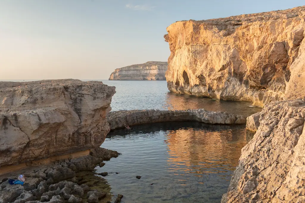 Limestone cliffs and still water at Dwejra, Gozo