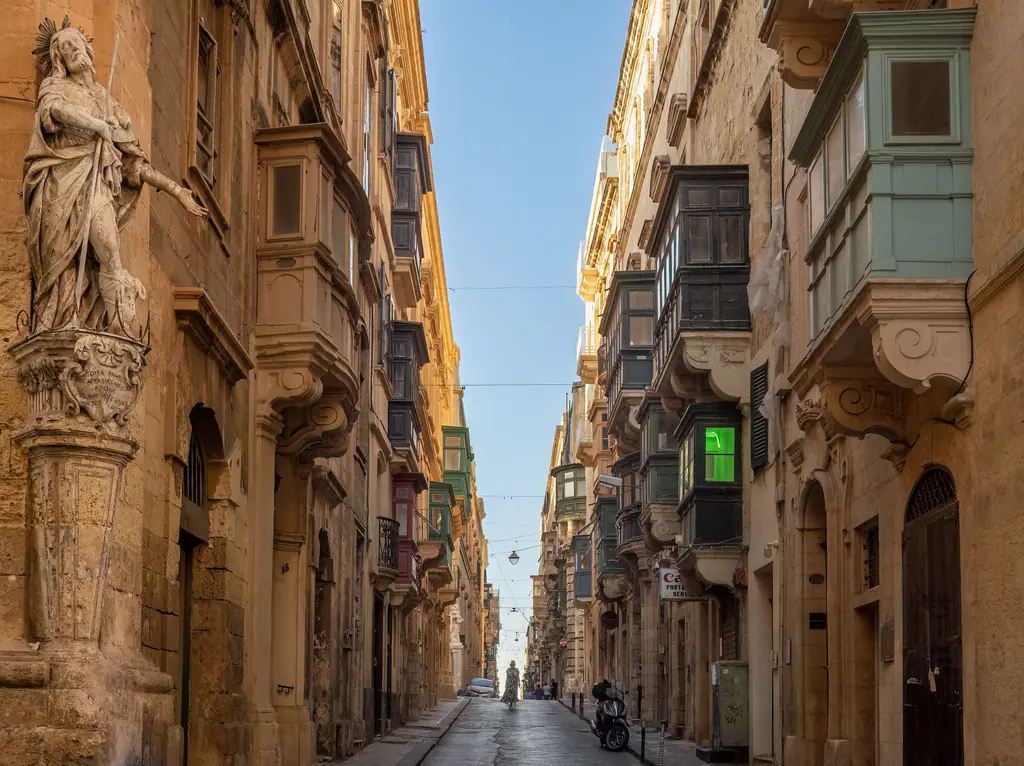 A Valletta street lined with traditional Maltese balconies